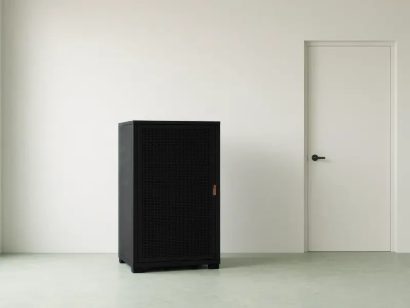 A small server rack in a tidy office comms room